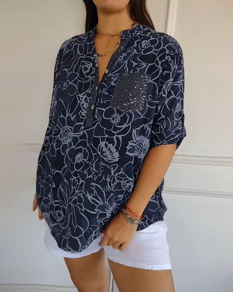 Versatile women's blouse with delicate floral print, ideal for casual chic or sophisticated wear.
