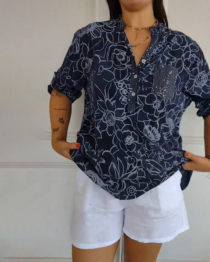 Fashionable women's long-sleeve floral blouse, perfect for a sophisticated and elegant ensemble.