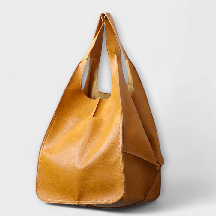 Everyday elegant faux leather tote for women, roomy interior for all your necessities.