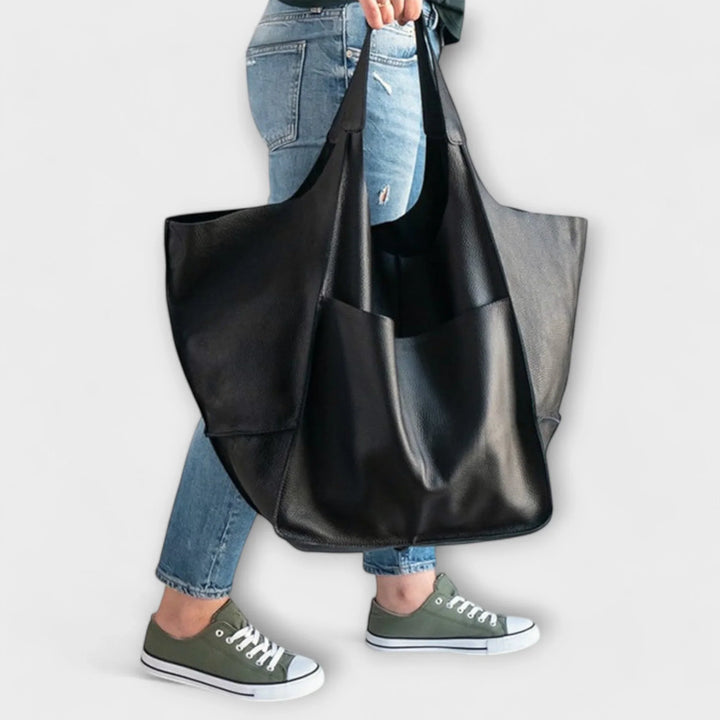 Tan faux leather ladies' tote bag, spacious, stylish, & perfect for an elegant casual look.