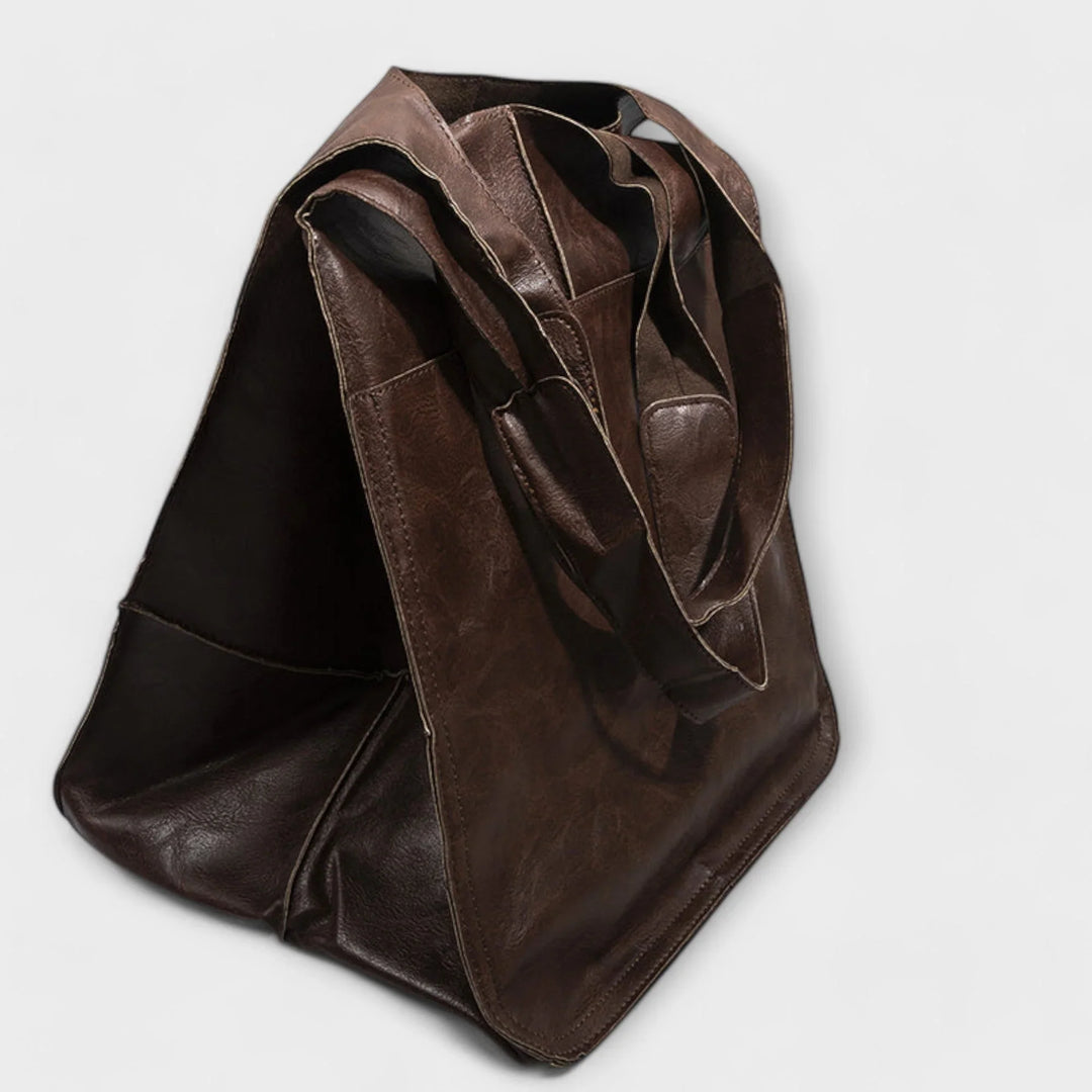 Minimalist ladies' faux leather tote bag, spacious & stylish for work or shopping.