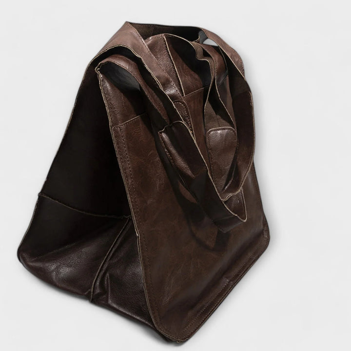 Minimalist ladies' faux leather tote bag, spacious & stylish for work or shopping.