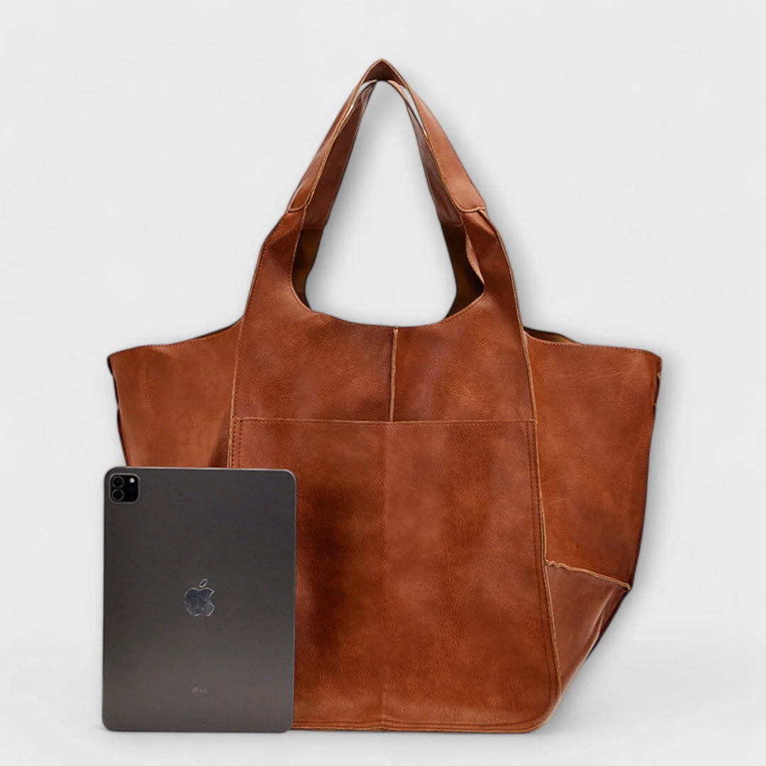 Stylish & versatile women's faux leather tote, ideal for carrying essentials comfortably.