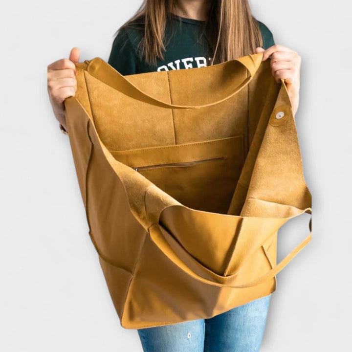 Sophisticated women's shoulder tote, spacious faux leather design for work & leisure.