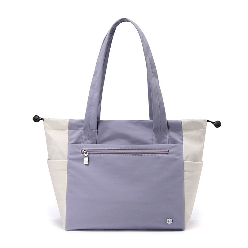 Elegant multi-functional women's tote bag, a spacious carryall ideal for daily use, work, or travel.