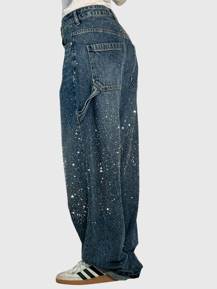 Close-up of diamond sparkle wide-leg pants fabric, showing intricate shimmer and luxurious detail.