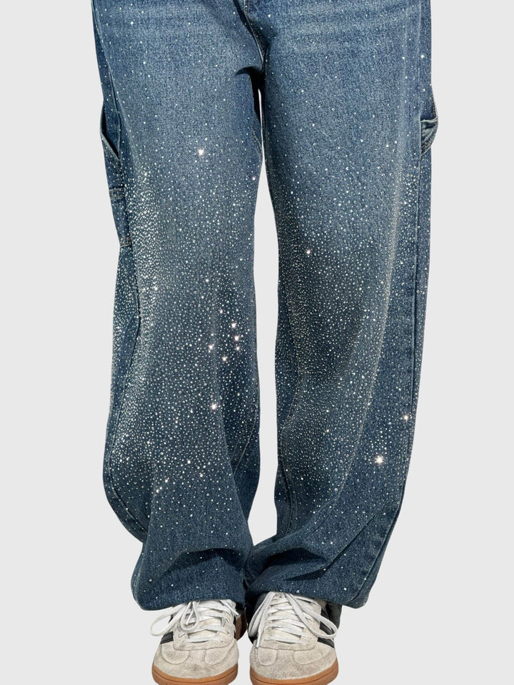 Model wearing versatile women's sparkle wide-leg pants, styled for a chic casual look.