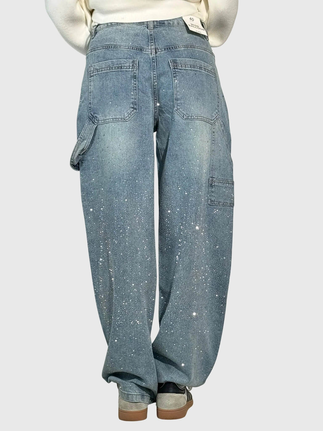 Full shot of women's shimmer wide-leg pants, showcasing their elegant drape and dazzling sparkle.