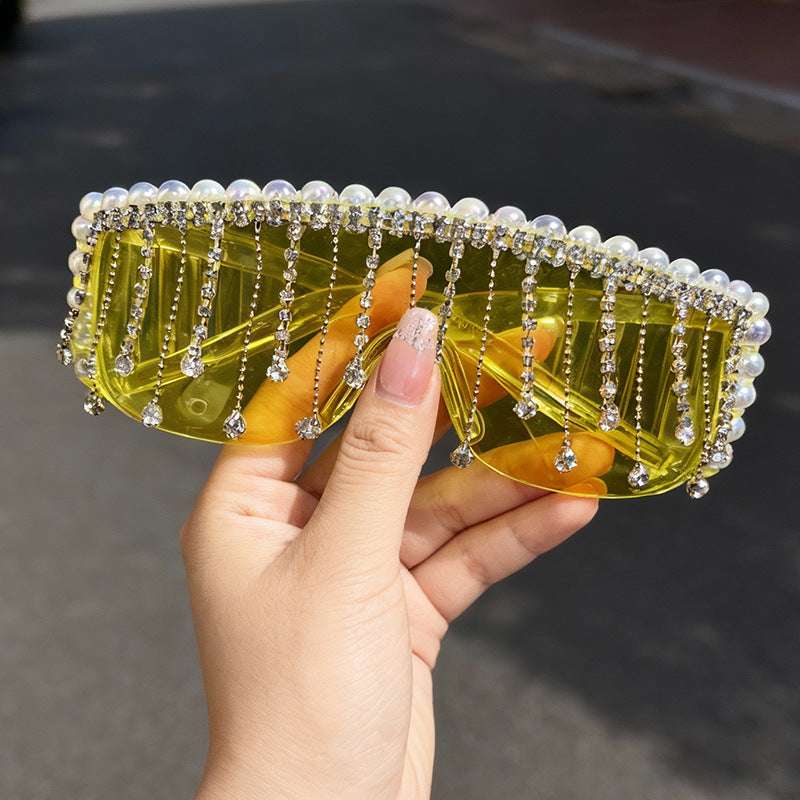 Stylish women's sparkling sunglasses featuring intricate bejeweled frames. UV protective & trendy summer eyewear.