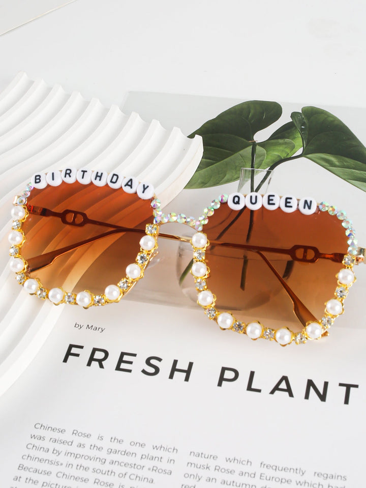 Elegant women's rhinestone heart sunglasses, "Birthday Queen" statement eyewear, offers UV protection.