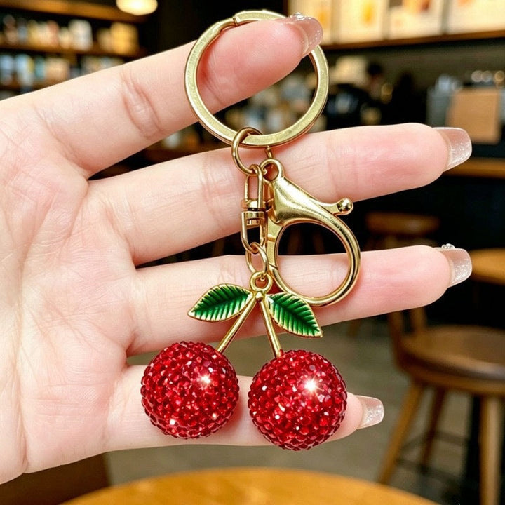 Shimmering cherry charm keychain for women, a glittery bag accessory perfect as a keyring or fashion gift.