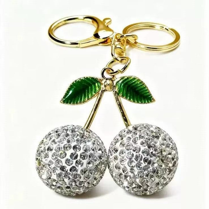 Women's sparkling cherry keychain accessory, a glittery bag charm and elegant keyring for daily fashion.