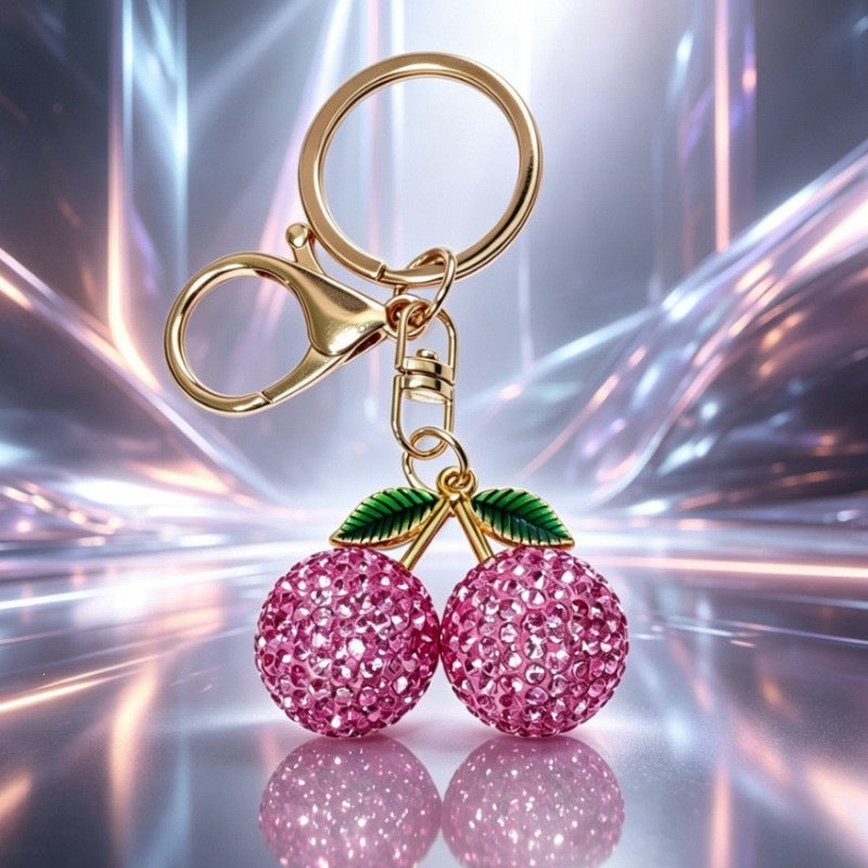 Red sparkling cherry keychain, a glittery charm accessory for women's handbags and a stylish keyring gift.