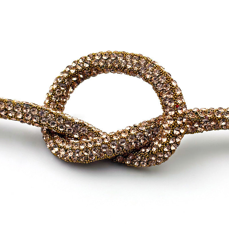 Women's decorative rope, richly adorned with sparkling crystals, a versatile fashion piece.