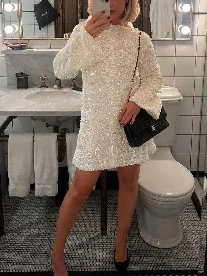 Elegant women's sparkling dress, featuring a beautiful bow back and glitter details.