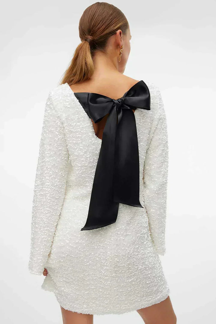 Elegant white sparkling party dress for women, ideal for formal wear events.