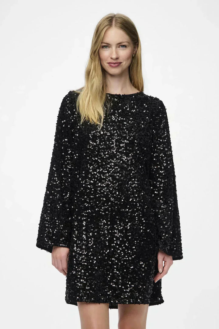 Formal wear women's dress, white and shimmering, with an elegant bow detail.