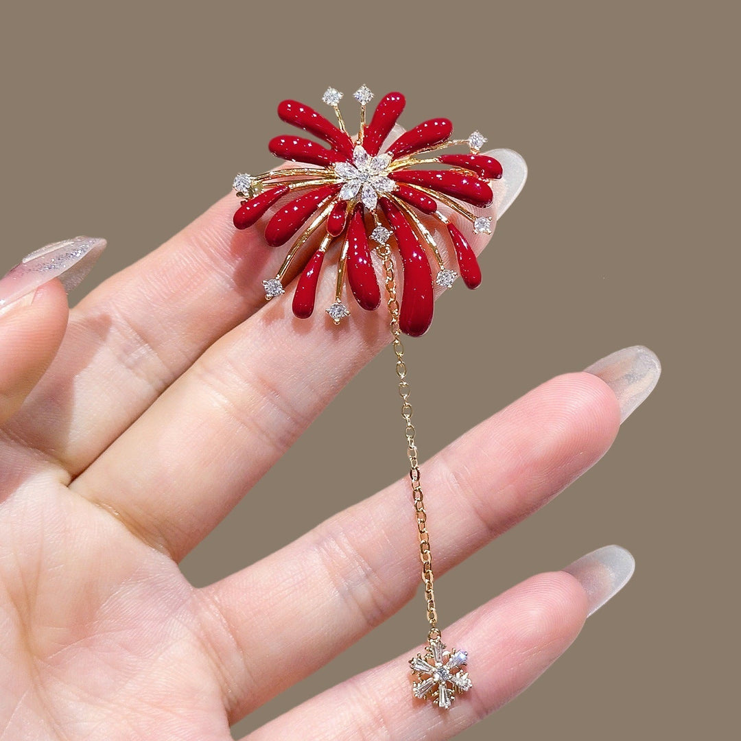 Women's sparkling flower brooch with elegant crystal accents and a delicate chain pendant, a chic accessory.