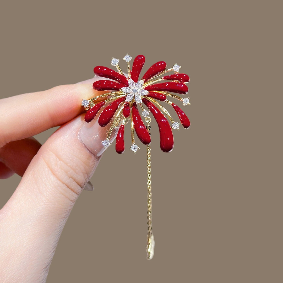 Close-up of a sparkling flower brooch, crystal-studded petals, and a graceful chain pendant for women.