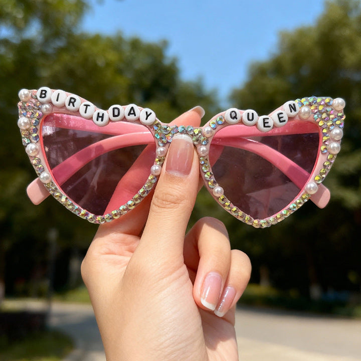 Women's sparkling heart rhinestone sunglasses. Glamorous party accessory with UV400 protection.