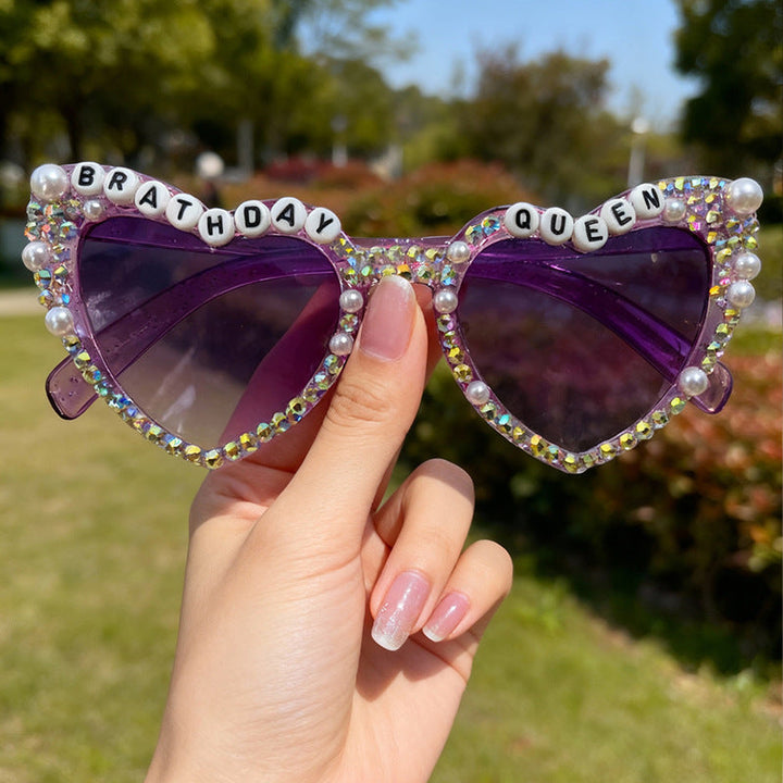 Women's fashion heart sunglasses featuring sparkling rhinestones. Perfect glamour and UV400 eye protection.