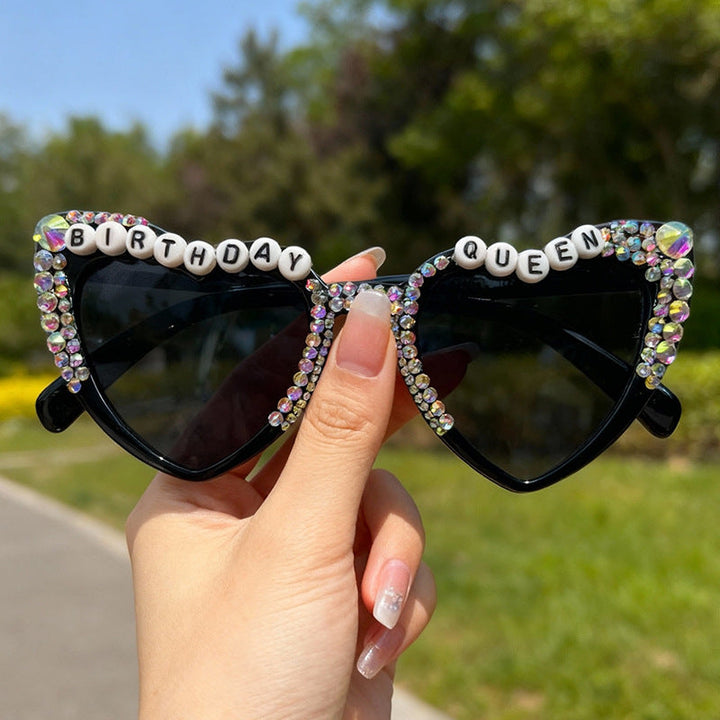 Women's sparkling heart-shaped sunglasses with rhinestones, providing essential UV protection.