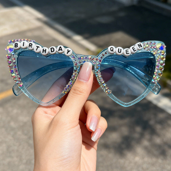Fashionable women's accessory: sparkling heart-shaped rhinestone sunglasses for a trendy look.