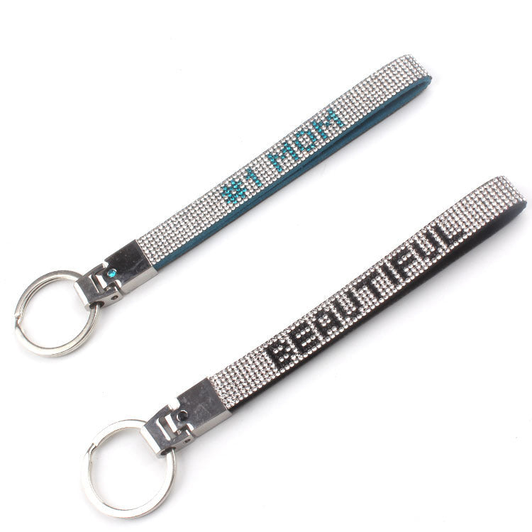 Elegant women's rhinestone keychain, a shimmering charm to accessorize bags & keys with sparkle.