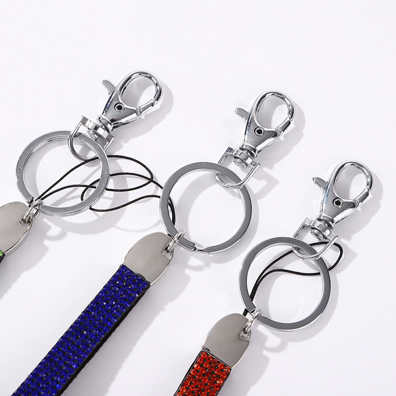 Stylish women's keychain featuring shimmering rhinestones, perfect for keys & bags.