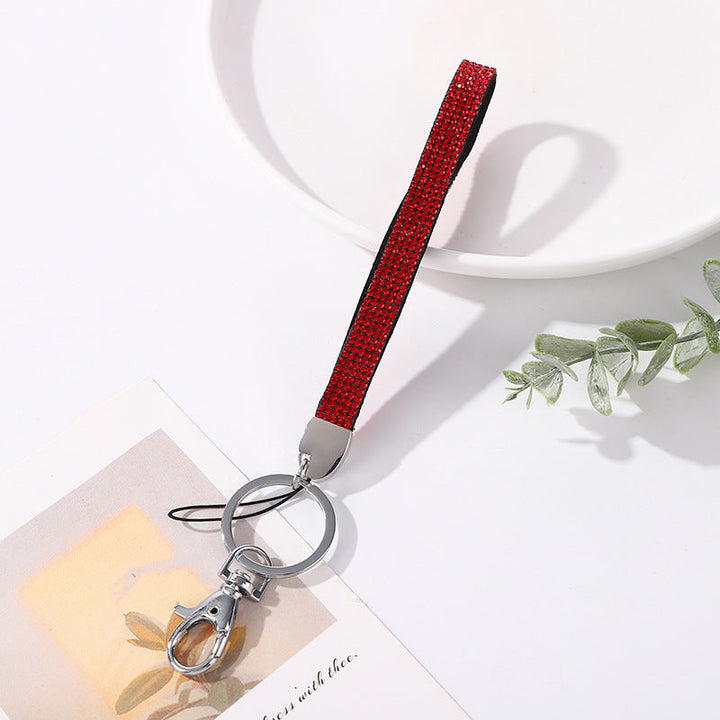 Crystal-encrusted women's keychain, a dazzling gift for her, holding keys with style.