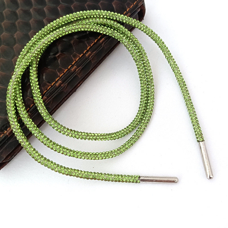Close-up of sparkling rhinestone shoe laces, showing glitter and bling, ideal for women's footwear customization.
