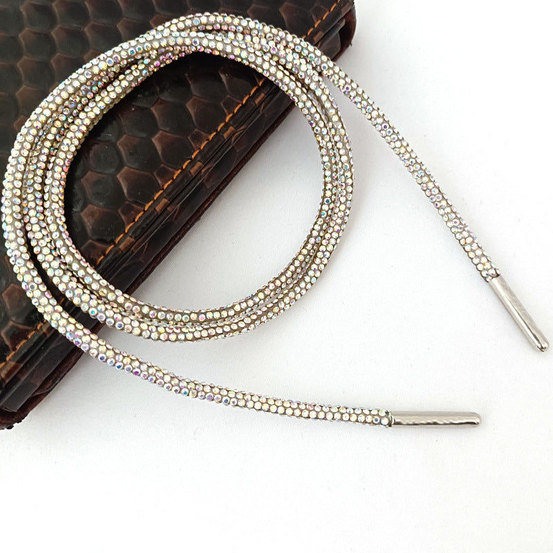 Silver sparkling rhinestone shoe laces for women, offering dazzling glitter and bling for custom footwear fashion.