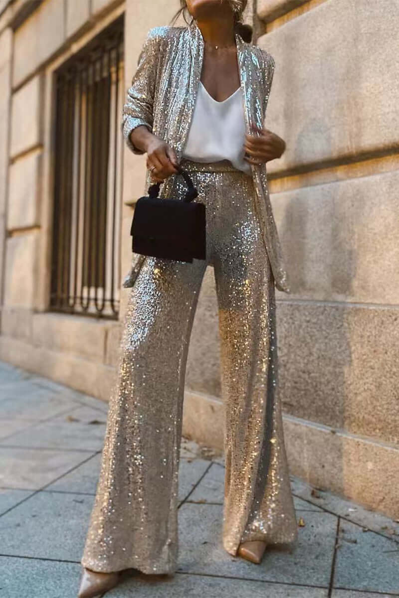 Women's sparkling sequin suit set features a long-sleeve top and wide-leg pants, perfect for evening wear & parties.