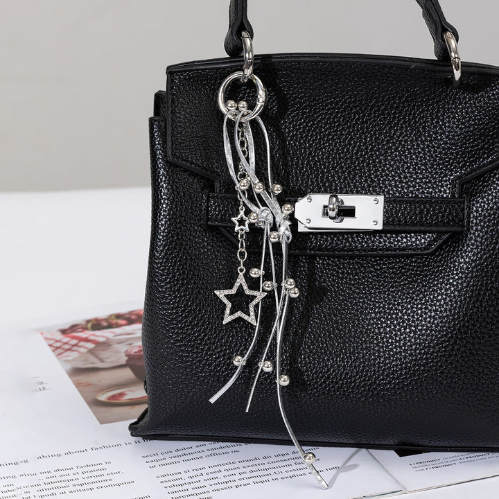 Fashionable sparkling star charm keychain for women's keys; also a trendy bag accessory gift.