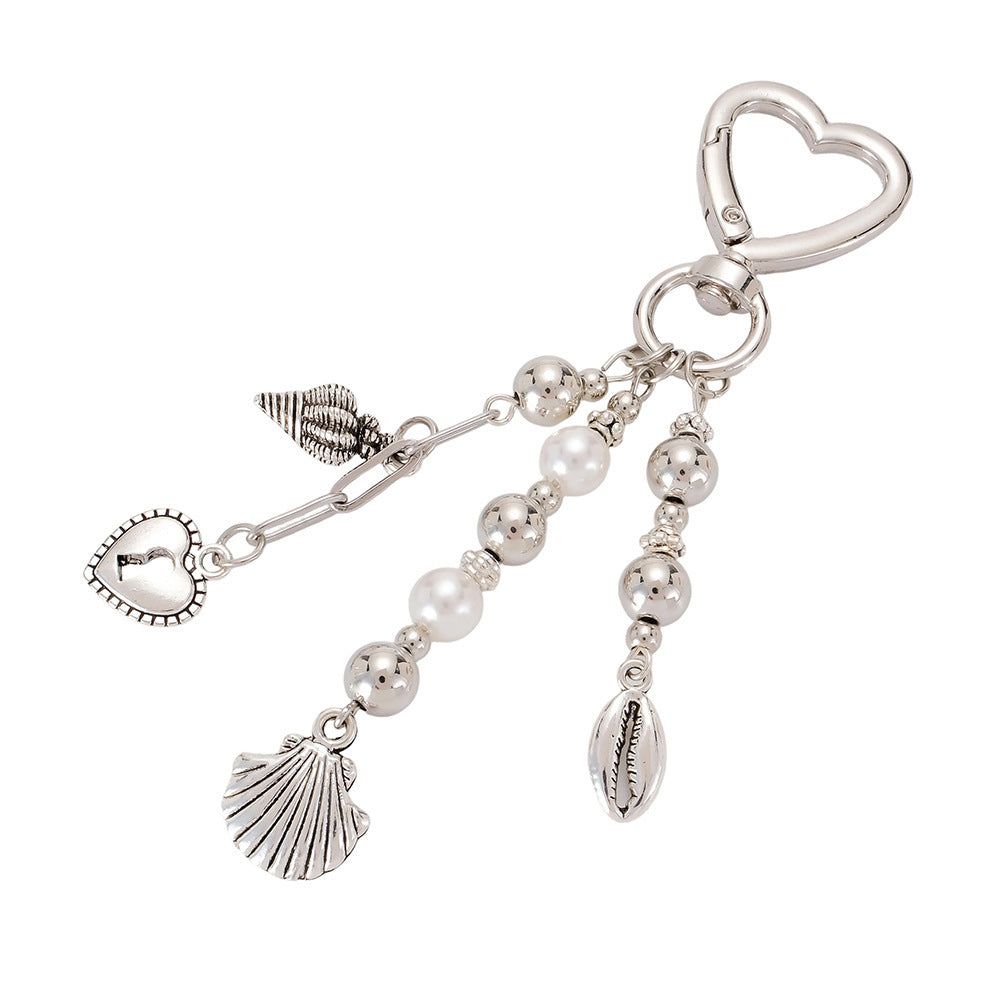 Sparkling star keychain, elegant silver & black bow design. A fashionable women's accessory & glitter bag charm.