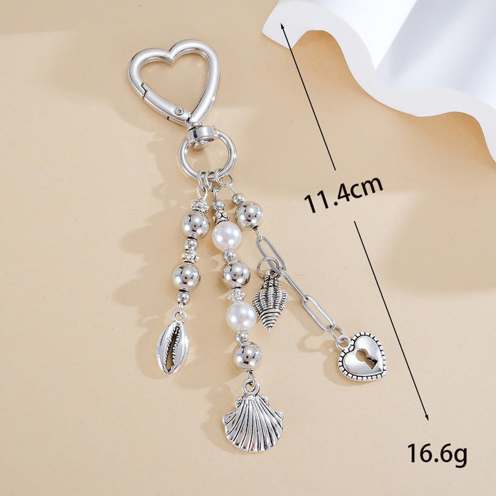 Chic sparkling star keychain with elegant bow. A beautiful women's fashion gift, stylish key holder & bag accessory.