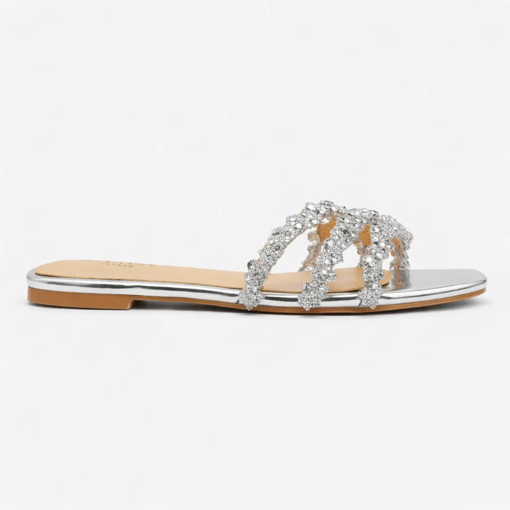 Shimmering silver flat sandals for women, triple strap design with square toe & sparkling crystals, summer fashion.