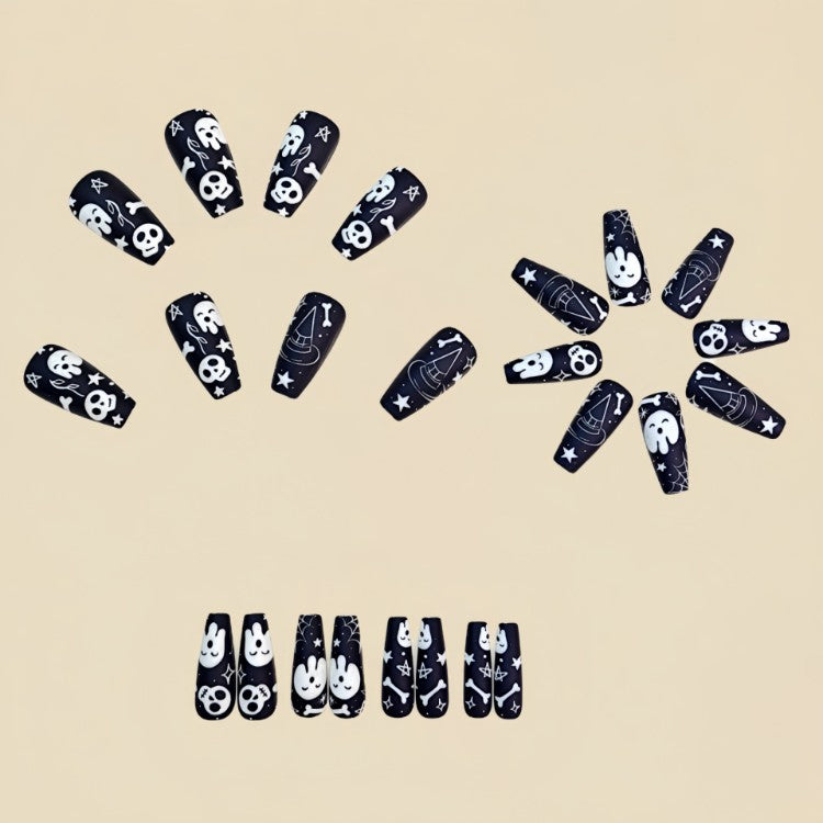 Spooky ghost, skull, & spider web Halloween press-on nail art tips for women. Easy false nails for festive looks.