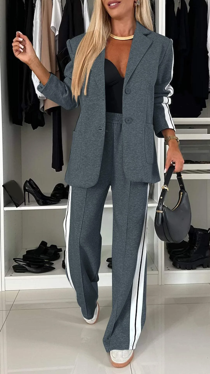 Oversized blazer from a women's sporty chic suit set. Modern fashion, casual elegant two-piece outfit.