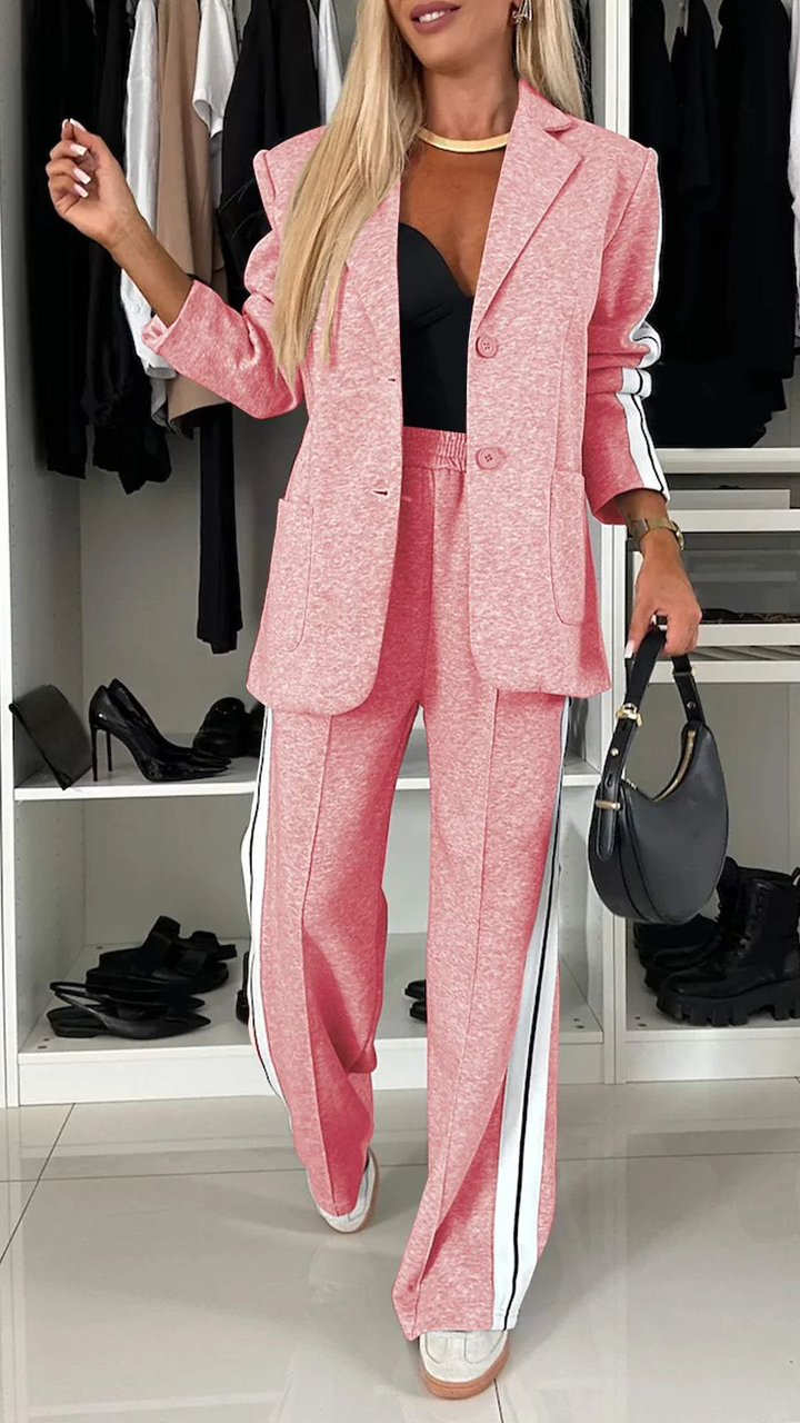 Women's urban luxe sporty chic suit with subtle accessories. Blazer and striped trousers, versatile outfit.