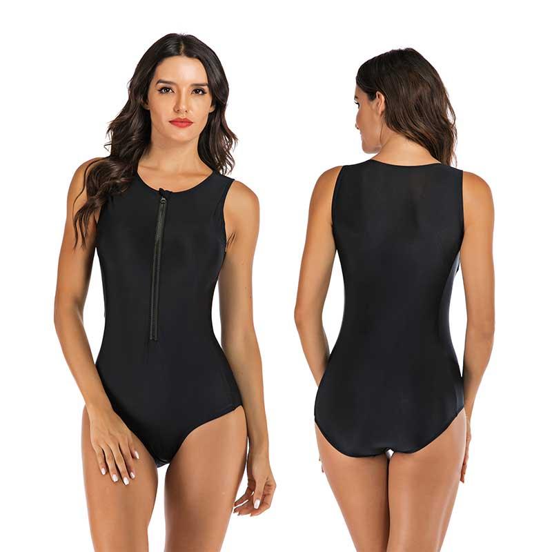 Woman confidently posing in a flattering one-piece sporty swimsuit. Perfect poolside style for summer fashion.