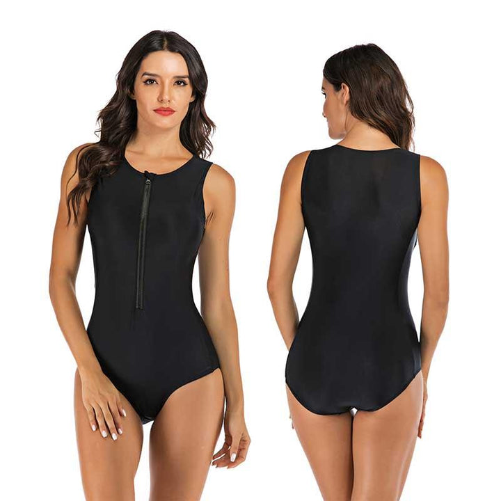 Woman confidently posing in a flattering one-piece sporty swimsuit. Perfect poolside style for summer fashion.