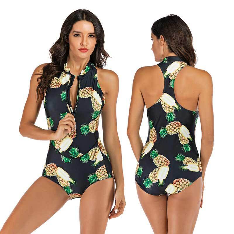 Happy woman enjoying a beach vacation in a sporty one-piece swimsuit. Active beachwear for summer fun & style.