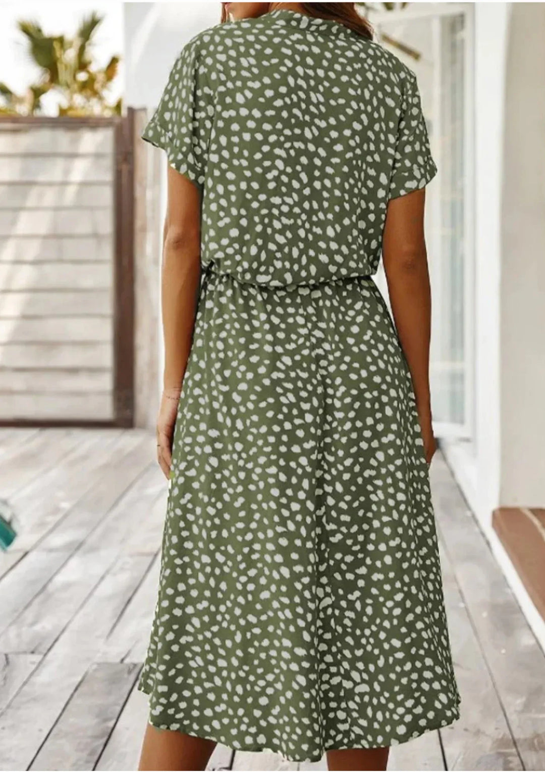Stylish spotted print midi dress for women, with a button-down design and an elegant drawstring waist.