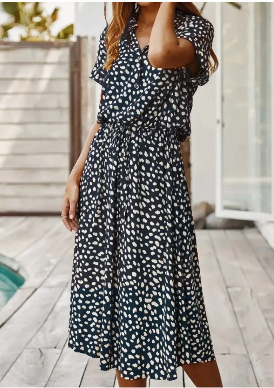Elegant women's spotted print midi dress, button-down front, and adjustable drawstring for a perfect silhouette.
