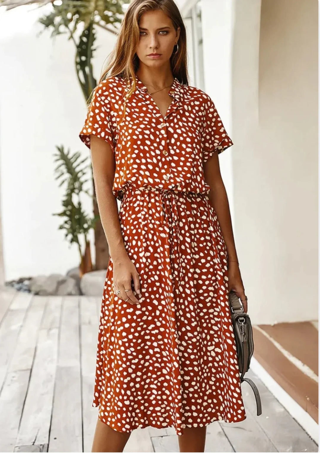 Chic V-neck spotted print midi dress, button-down, with flutter sleeves and an adjustable drawstring waist.