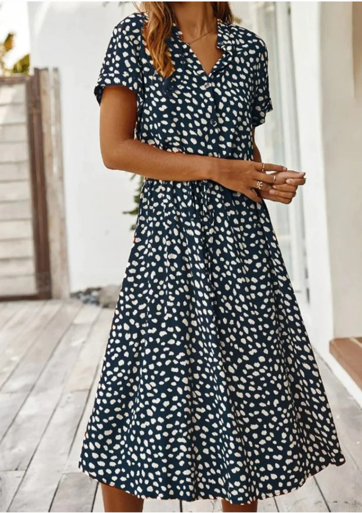 Comfortable women's spotted print summer midi dress, styled with a button-down front & drawstring waist.