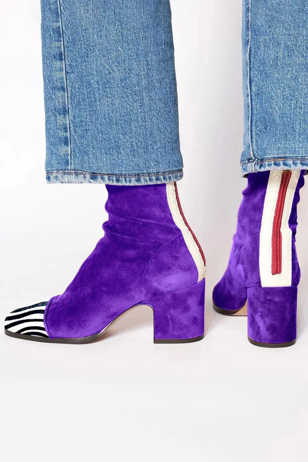 Stylish women's square toe block heel ankle boots. Modern design for elegant fall and winter ensembles.