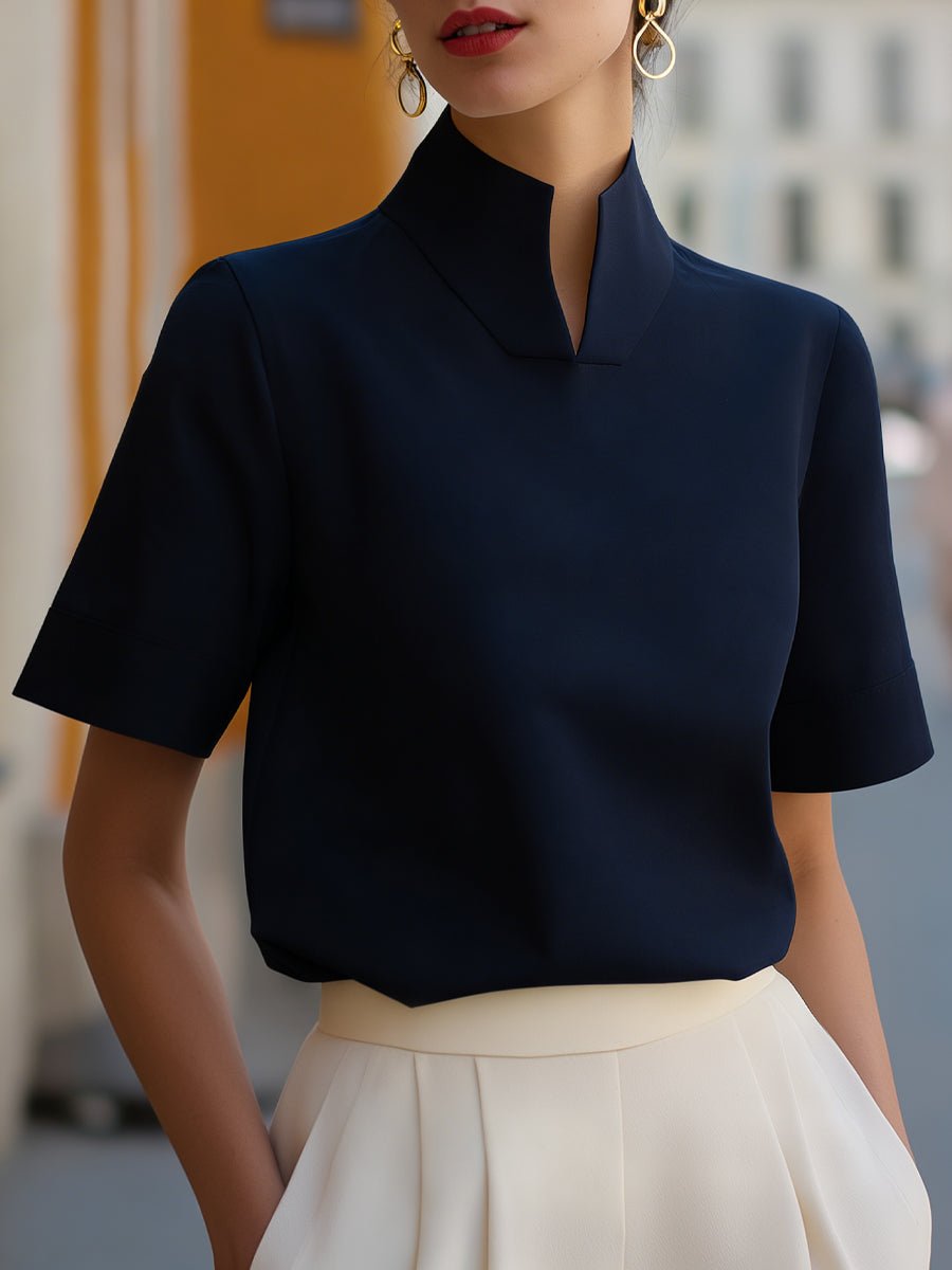 Comfortable & chic women's structured blouse, stand collar & short sleeves, perfect for professional attire.