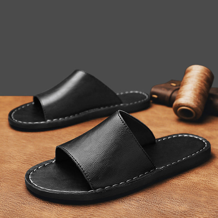 Stylish women's stitched flat open-toe sandals. Comfortable casual slip-ons for summer fashion.